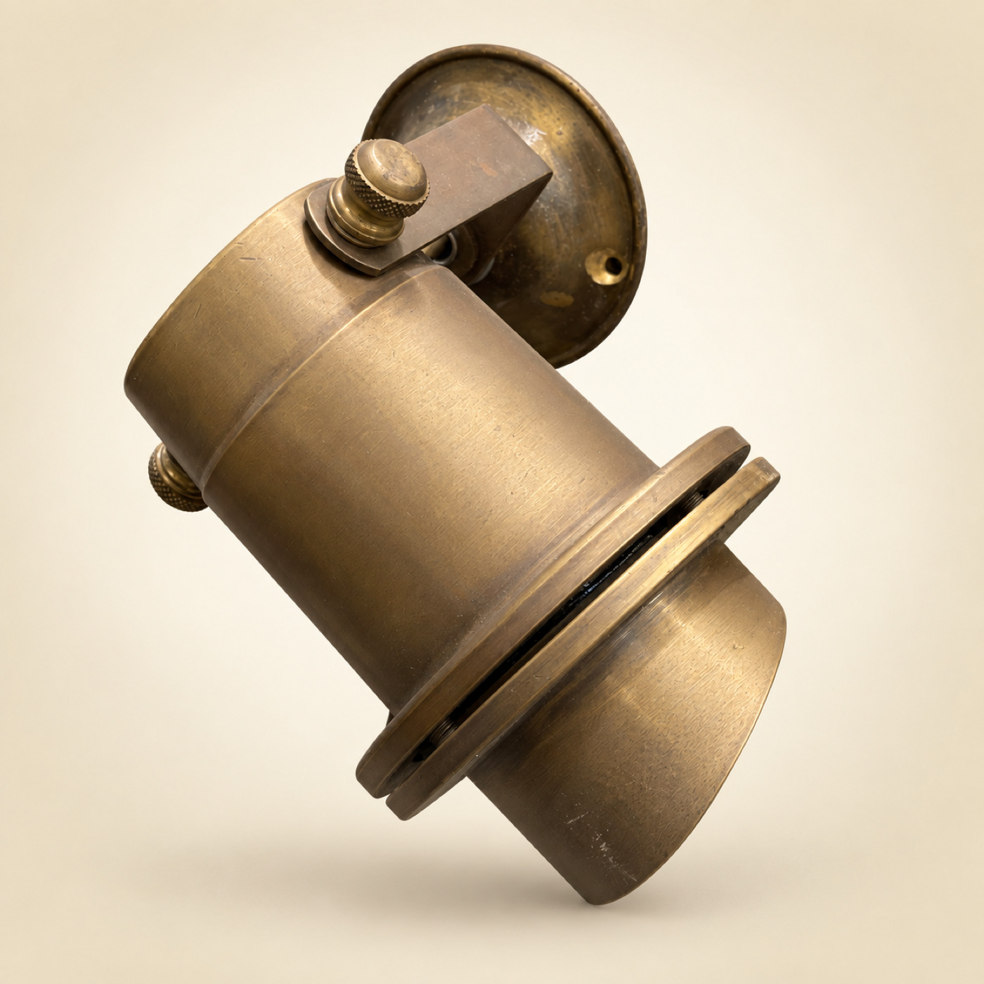 Brass Cylindrical Wall Spotlight with Round Wall Plate and Adjustable Knuckle with Thumb Screws — K67 — Angle 1