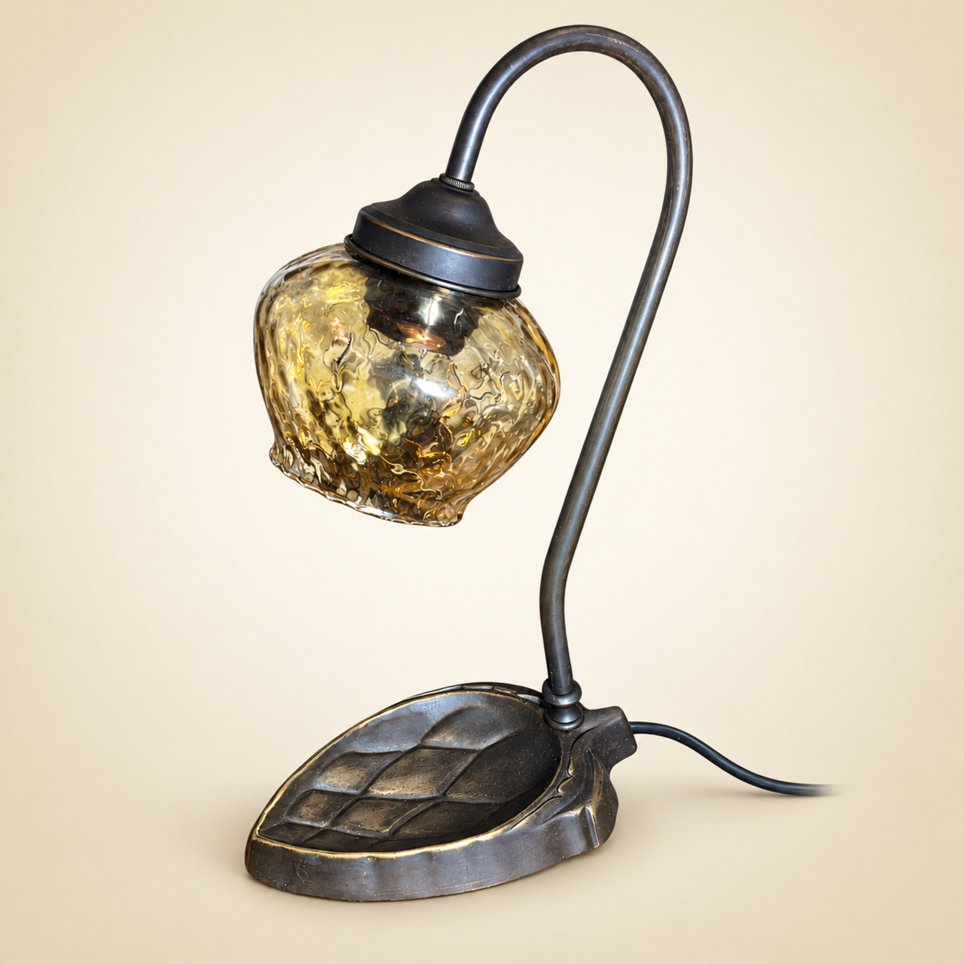 Bronze Table Lamp with Curved Gooseneck Arm, Textured Amber Glass Globe and Leaf-Shaped Base — S48 — Angle 1