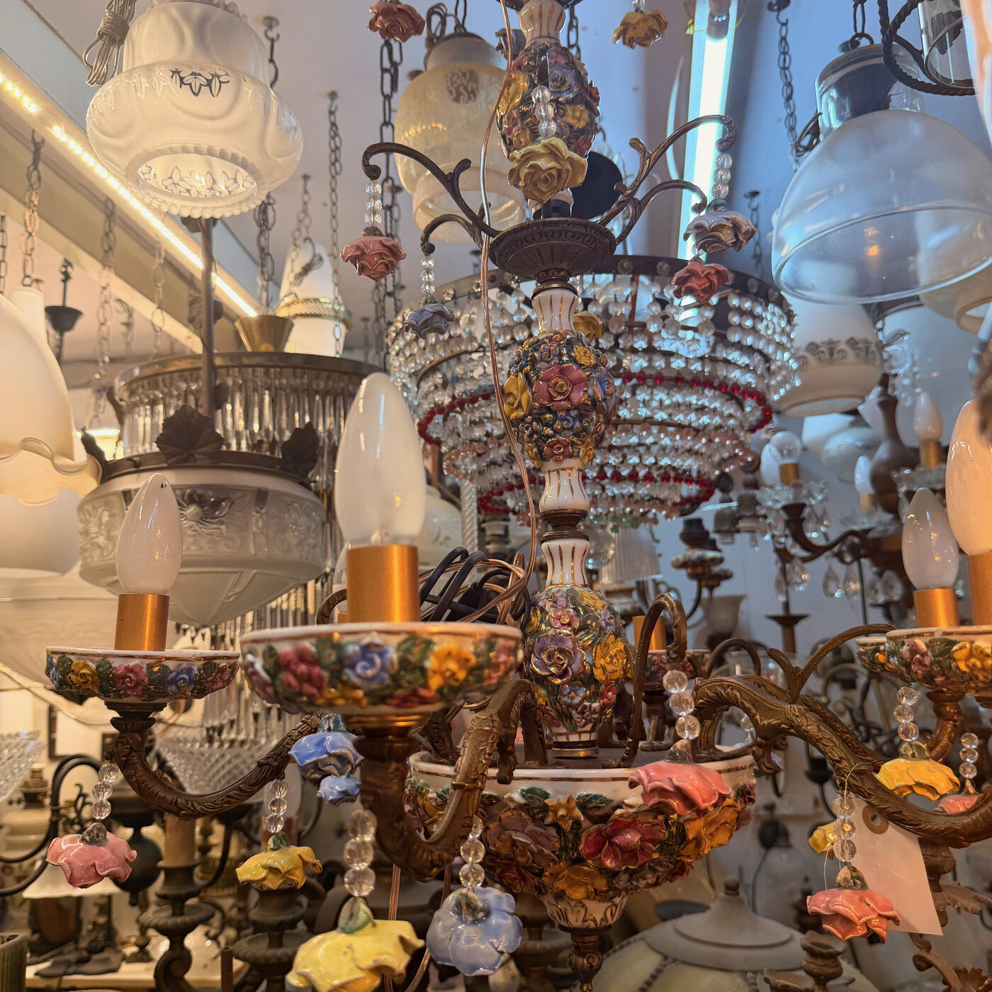 Large Multi-Arm Bronze Capodimonte-Style Chandelier with Coloured Porcelain Flowers, Porcelain Bobeches and Bowl, and Crystal and Flower Drops — H68 — Angle 2