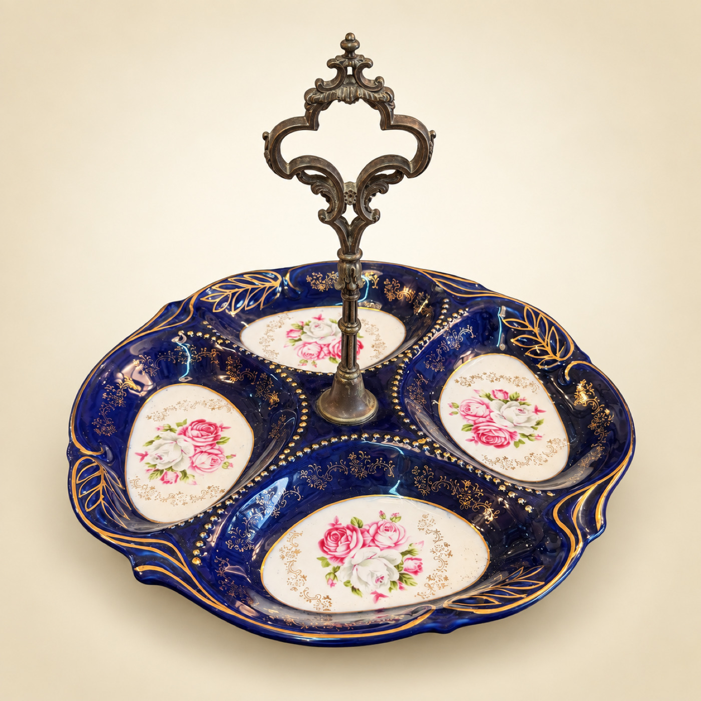 Cobalt Blue Porcelain Four-Section Serving Dish with Rose Medallions, Gilt Decoration and Ornate Cast Metal Center Handle — P21 — Angle 1